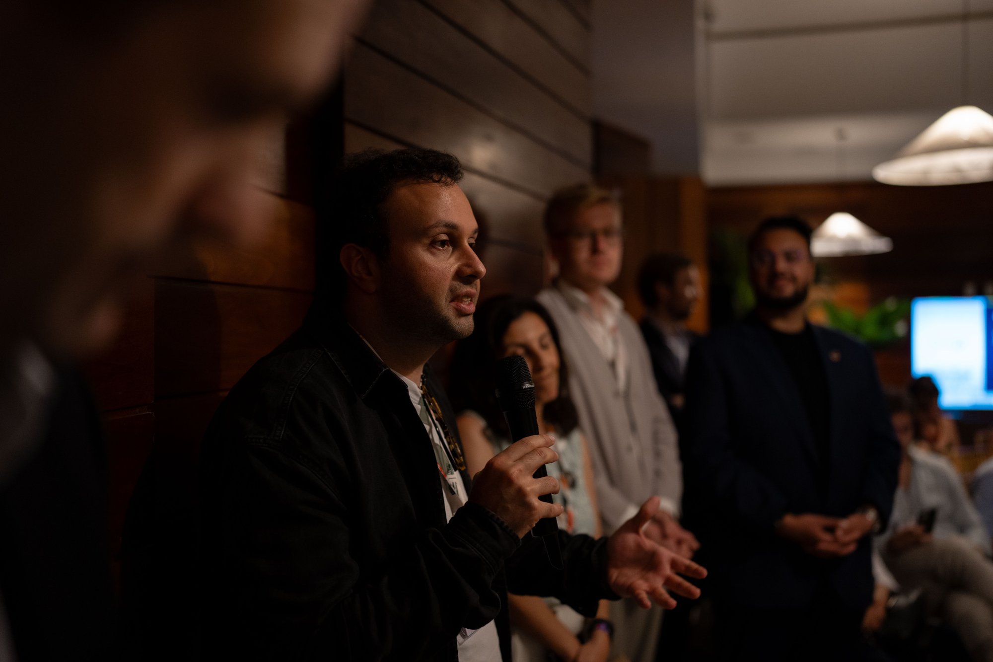 A founder speaking to the audience at Actions House, COP30